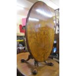 A good quality Victorian walnut tilt top breakfast/loo table of oval form with well matched figure