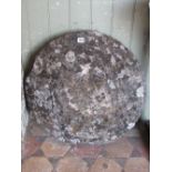 A weathered natural stone staddlestone cap, 60cm diameter approx