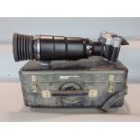 A cased Zenit photosniper ES reflex camera with a Tair-3 Phs long focus lens and accessories