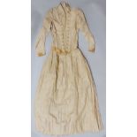 Late 19th century jacket and full length skirt in beige silk, with linen lining, comprising fitted