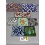 A collection of 19th century and later decorative tiles including floral examples, tin glazed