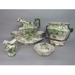 A collection of late 19th century toilet wares with green printed floral decoration comprising