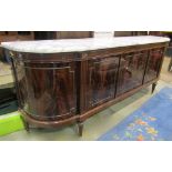 A substantial neoclassical style sideboard enclosed by five doors with well matched flame veneers,