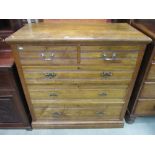 An Edwardian ash bedroom chest of two short over three long graduated drawers with reeded tramline