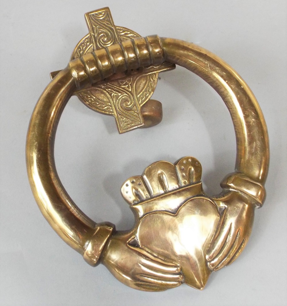 A good polished cast bronze Irish Claddagh door knocker in the form of a crowned heart in a pair