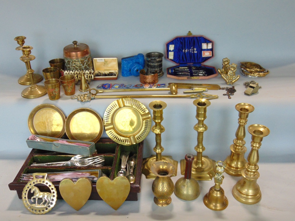 A box containing a mixed collection of metal wares to include various brass candlesticks and