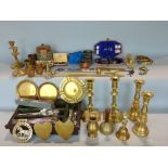 A box containing a mixed collection of metal wares to include various brass candlesticks and