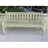 A weathered teak three seat garden bench with slatted seat and back, 5ft long approx