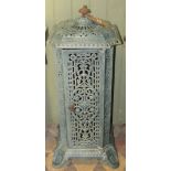 A Victorian cast iron and enamel floor standing conservatory heater of square cut and canted form,