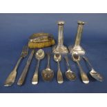 A mixed collection of silver comprising a pair of early 20th century silver candlesticks, six