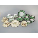 A collection of pale green ground Art Deco type continental teawares with silvered border and