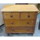 A Victorian stained pine bedroom chest of two short over two long drawers, raised on turned