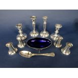 A mixed collection of silver to include two pairs of dwarf candlesticks, two pairs of salt and
