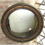 A reproduction Regency style convex wall mirror with ebonised reeded slip and ball surround, 47cm