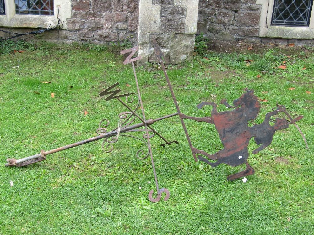 An ironwork weather vane, the raised cut sheet steel finial in the form of a mounted cavalry man