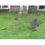 An ironwork weather vane, the raised cut sheet steel finial in the form of a mounted cavalry man