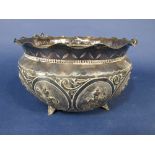 Interesting Indian silver fruit bowl decorated in relief with oval panels of Buddistic deities, 24cm