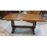 A reproduction stained oak and beechwood occasional table of rectangular form in the Old English