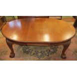 An Edwardian mahogany extending D end dining table with gadrooned borders, raised on four