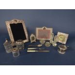 A box containing a large quantity of various silver to include four silver easel picture frames, a