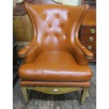 A pair of contemporary drawing room chairs in the 19th century style with tan coloured leather