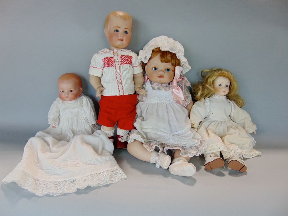 A collection of four various bisque headed dolls to include an Armand Marseille baby doll example