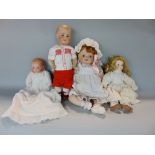A collection of four various bisque headed dolls to include an Armand Marseille baby doll example
