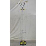 A floorstanding retro hat and coat stand with atom yellow coloured moulded plastic terminals and