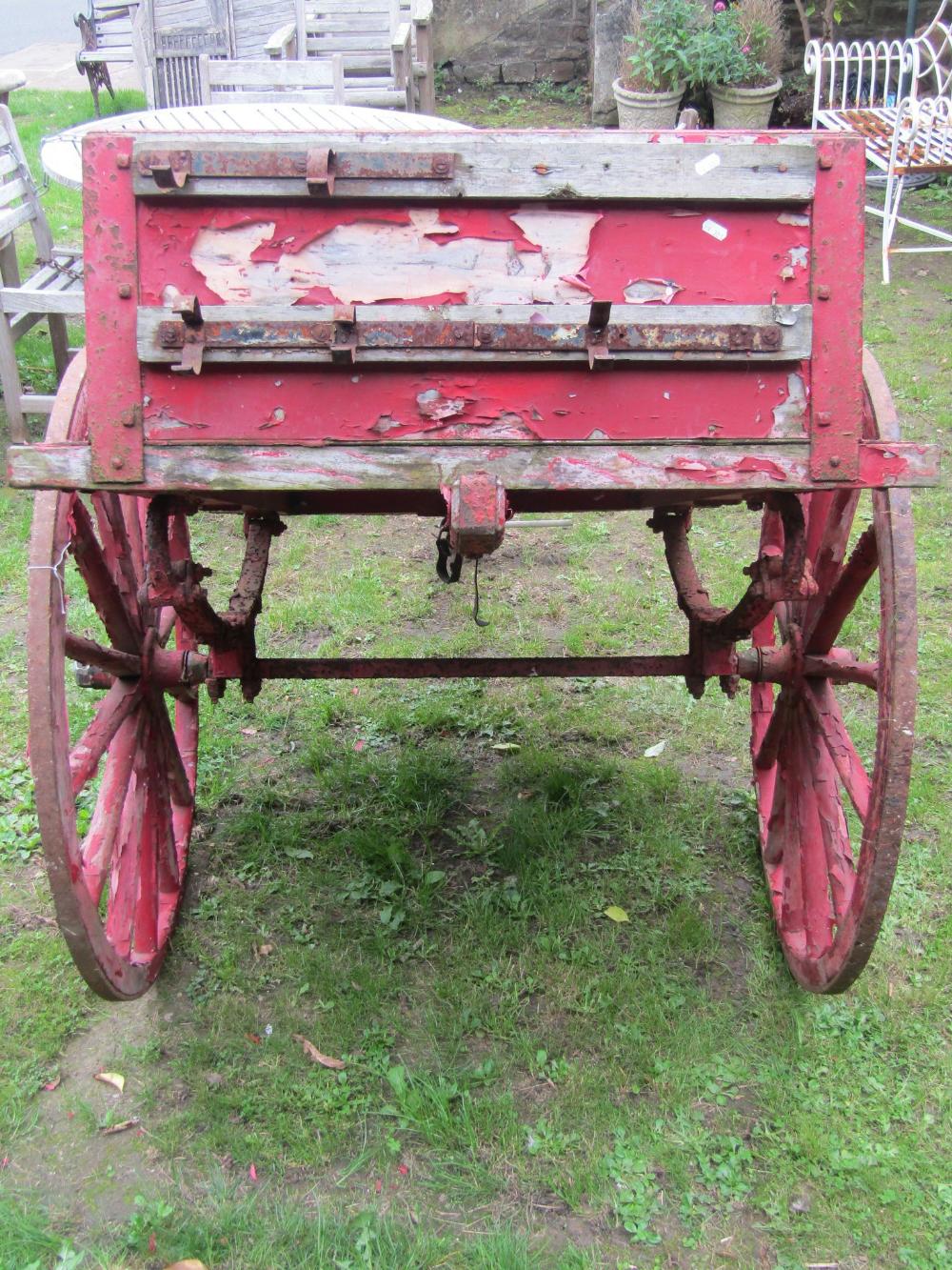 A vintage wooden hand cart with iron fittings, two spoke wheels with iron rims and red painted - Image 4 of 4