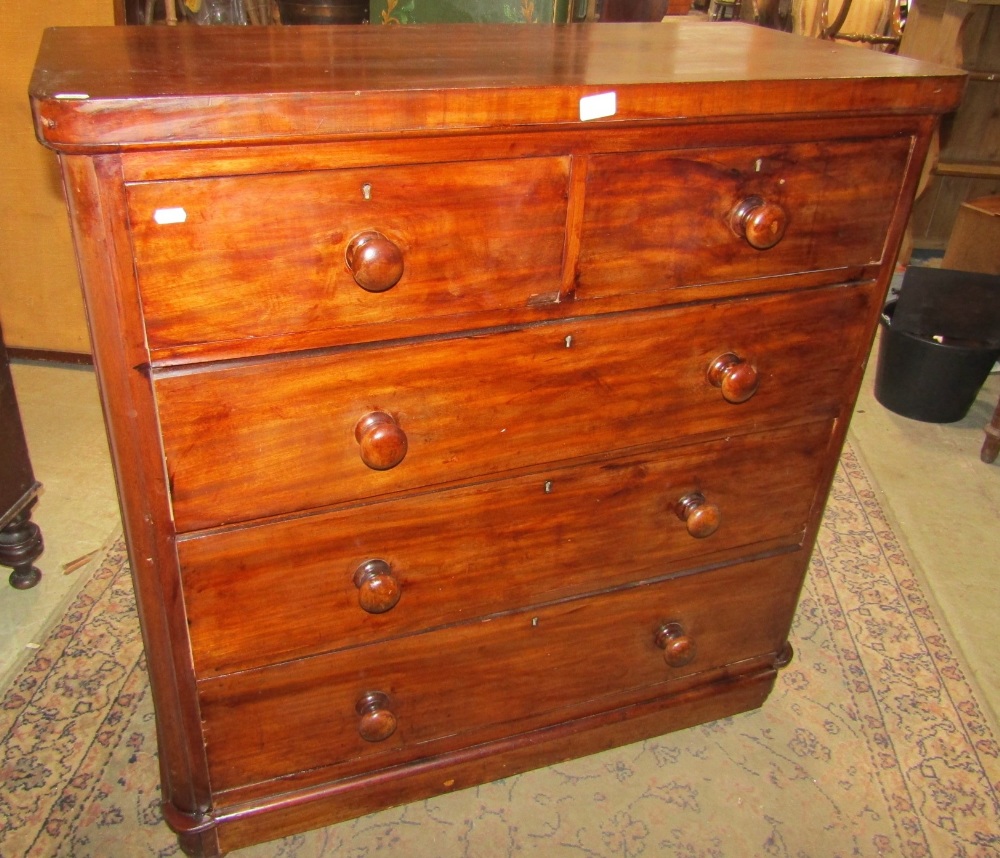 A Victorian mahogany veneered bedroom chest, of two short over three long graduated drawers, with