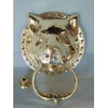 Interesting cast brass door knocker in the form of a pig with the handle in its mouth, 18cm high