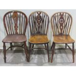 A collection of six Windsor hoop back dining chairs in elm ash and beechwood, to include four