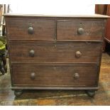 A small mid-19th century mahogany chest of two long and two short drawers, on turned supports,