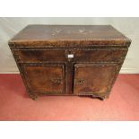 An unusual leather clad chest with brass stud work detail, with rising lid revealing a shallow