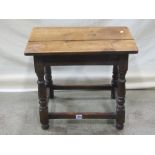 A small Old English style oak occasional table or stool of rectangular form with moulded rails and