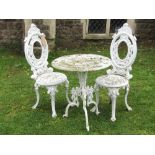 A good quality cast aluminium three piece garden terrace set of Victorian style with decorative