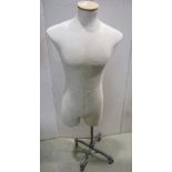 A vintage tailors/shop display mannequin labelled Aubin & Wills raised on a cast alloy stand with