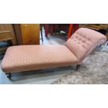 A Victorian chaise/day bed with floral lattice patterned upholstered seat and rolled button back