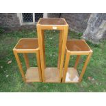 An Uldum Danish pair of light oak floorstanding pedestal display units with inset glass tops and