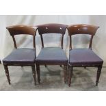 A set of six 19th century mahogany dining chairs with curved bar backs over upholstered seats and