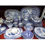 A collection of 19th century and later blue and white printed wares including two oval graduated
