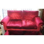 A good quality contemporary three seat sofa in a traditional style with rolled arms plus plum