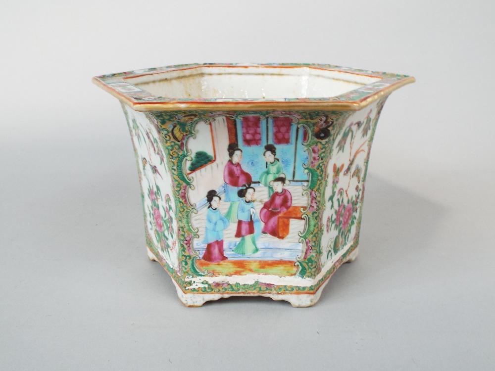 A 19th century Cantonese jardiniere of hexagonal form with flared rim and polychrome painted