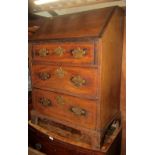 A small Georgian mahogany writing bureau, the fall flap enclosing a simple pigeon holed interior,