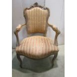 A 19th century open armchair with alternating striped upholstered seat and back within a shaped