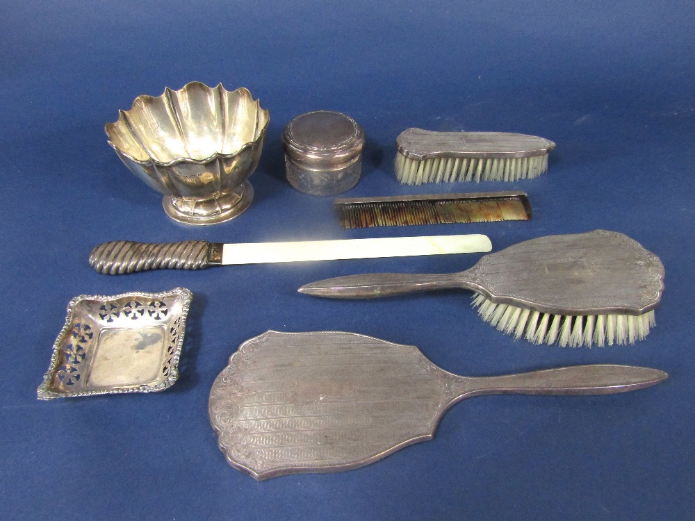 A box containing a mixture of silver to include a silver floral bonbon dish, a silver trinket dish