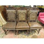 A set of six substantial 19th century oak dining chairs in the Renaissance manner, the frames with
