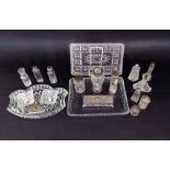 A large collection of glass and silver dressing items to include scent jars, powder jars, etc (a