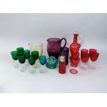 A mixed collection of 19th century and later coloured glass to include a set of five green glass