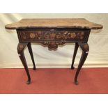A Dutch marquetry side table, with turret corners, over a single frieze drawer on four pad feet,